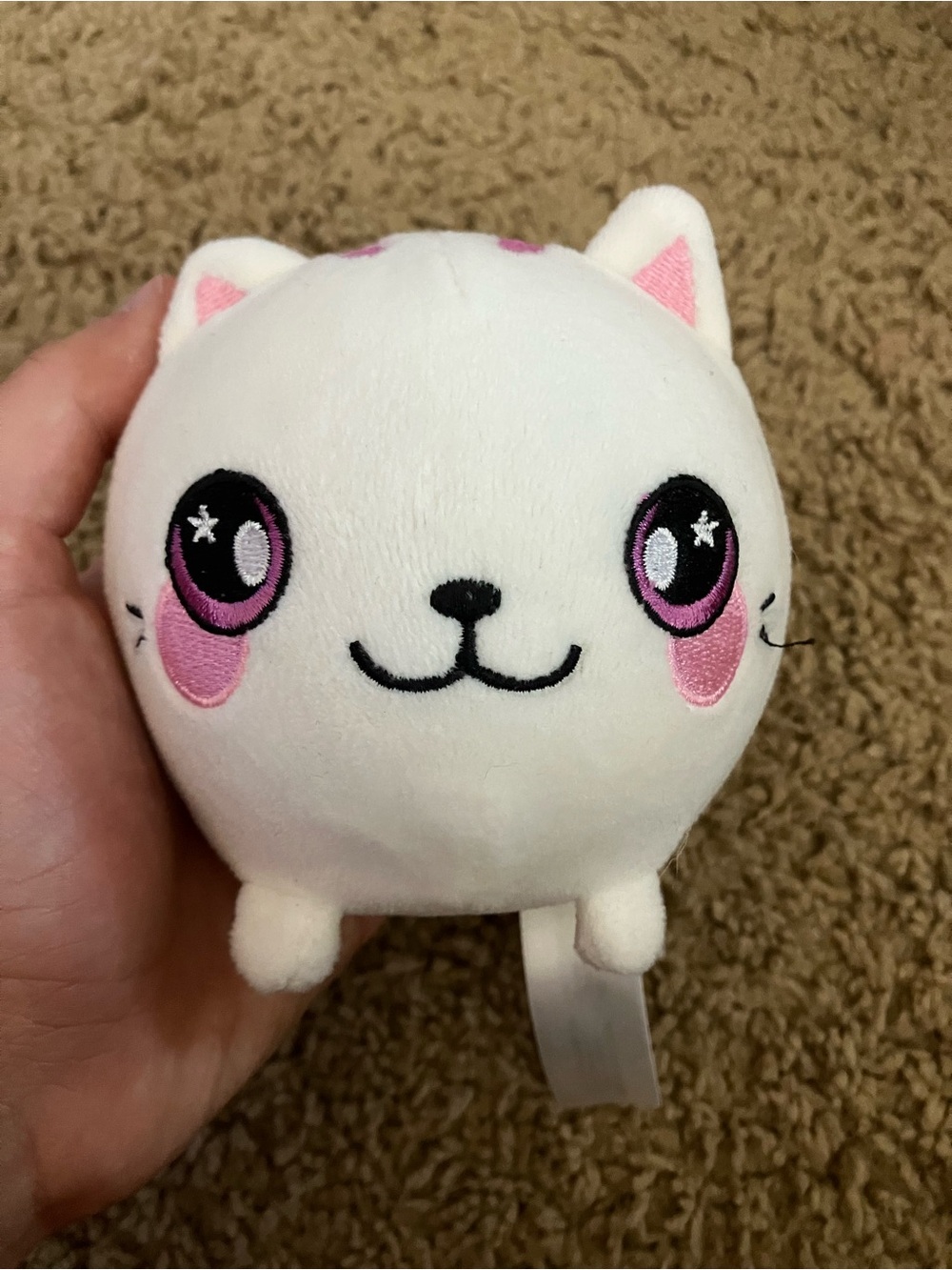 White and pink cat Squeezamals plushie with pink cheeks